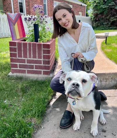 dottie and julia outside in front of a pride flag